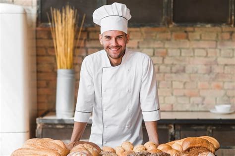 Portrait of a happy male baker | Free Photo