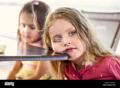 Head resting on table hi-res stock photography and images - Alamy