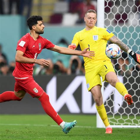 Download Jordan Pickford Stealing Ball From Opponent Wallpaper
