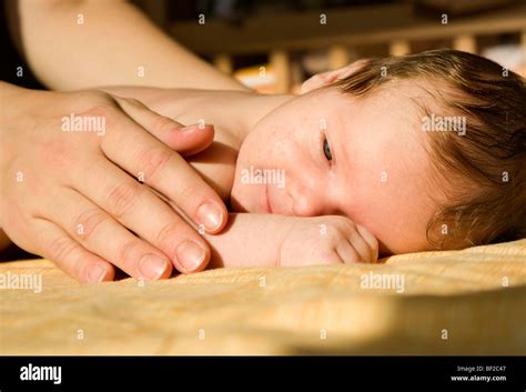 baby and hands of mother Stock Photo - Alamy