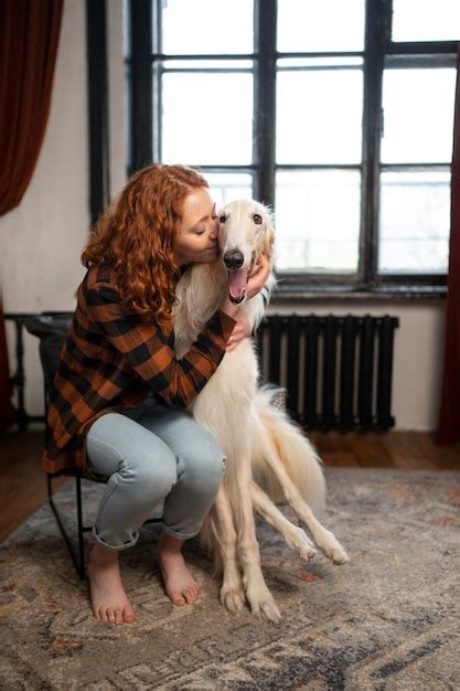 Free Photo | Full shot woman with cute greyhound dog