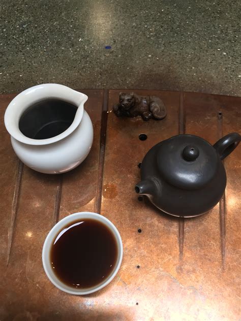 Sheer Kahn, my tiger tea pet enjoying 18 year aged sheng Pu-erh. Sheng