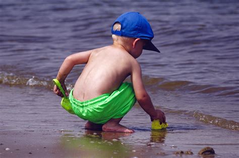 young boy playing   shore image  stock photo public domain