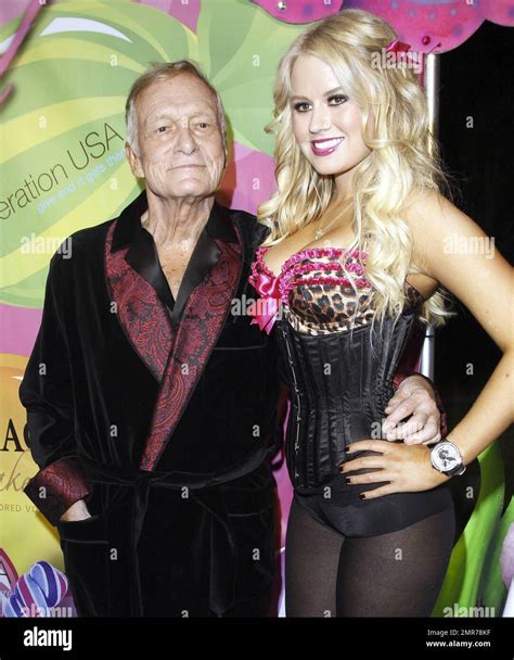 Despite his recent wedding cancellation, Hugh Hefner looked very happy