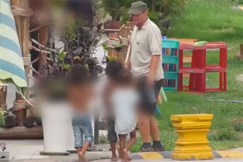 Video shows sickening moment suspected paedophile walks hand-in-hand ...