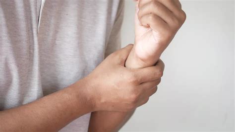 Man holding wrist, in pain, trauma, cramps 14205756 Stock Video at Vecteezy