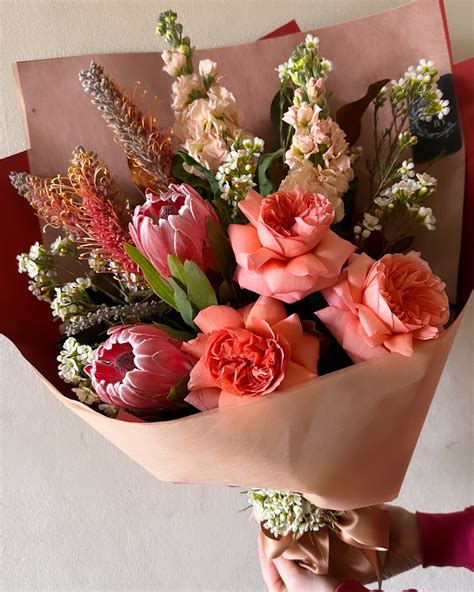 Seasonal bouquet in warming peachy tones. Perfect for a cold winters