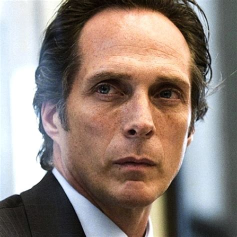 William Fichtner as the Manager of Gotham National Bank,"The Dark ...