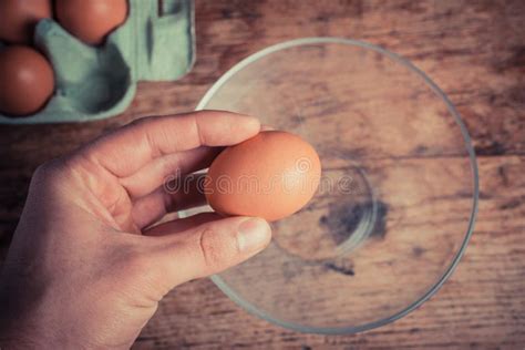 Hand cracking egg stock image. Image of bake, cooking - 38616173