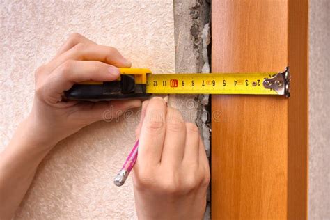 Measuring With Tape Measure On Wall Stock Photo - Image of accuracy ...