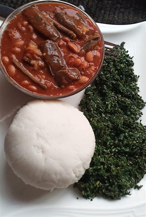 Delicious Ugandan Food: Rice and Beans with Meatballs in Sauce