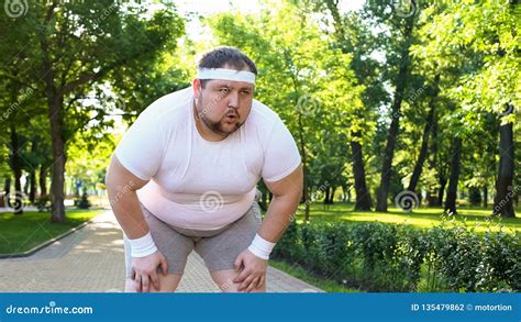 Purposeful Fat Man Running in Park, Out of Breath, Persistent ...