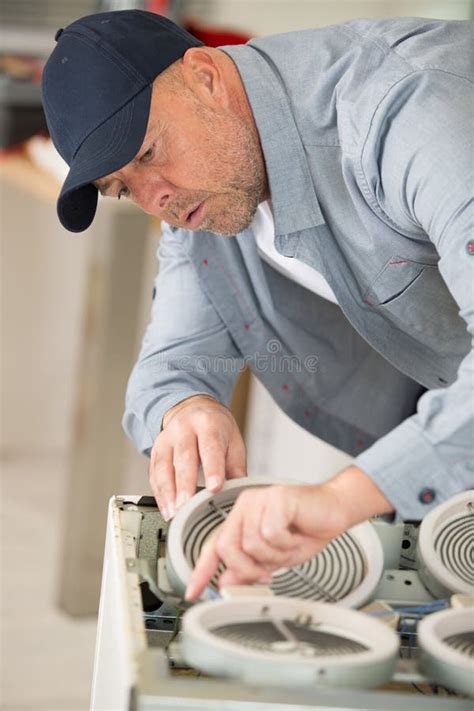 Installing New Hob in Modern Kitchen Stock Image - Image of checking ...