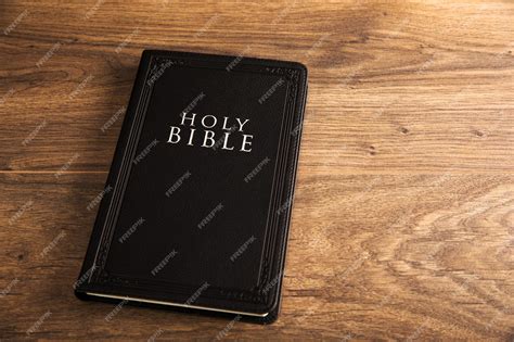 Premium Photo | Holy Bible on the wooden table