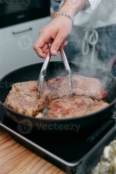 cooking steaks in a pan. cooking beef at the culinary master class. the