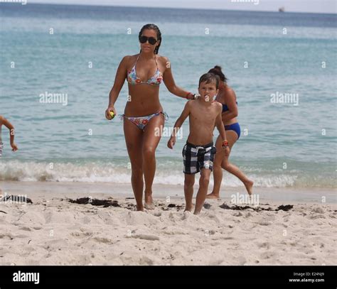 Sylvie van der Vaart at the beach with her son Damian Miami Beach, Florida - 09.10.2013 ...