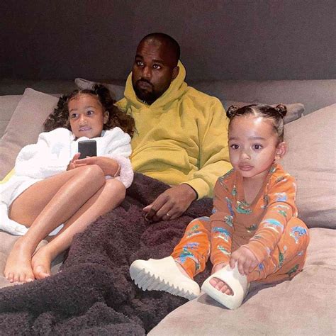 Kanye West Cuddles with Daughters Chicago and North for TV Time