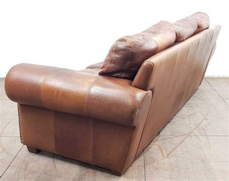 Lot - Traditional Style Rustic Leather Sofa & Ottoman