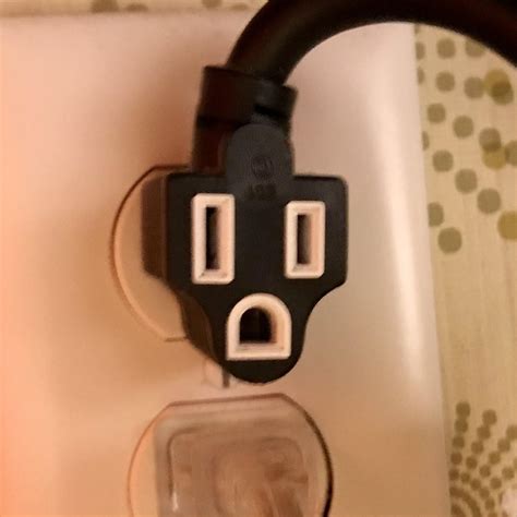 Outlet in my hotel room looks like a shocked, masked robber : r