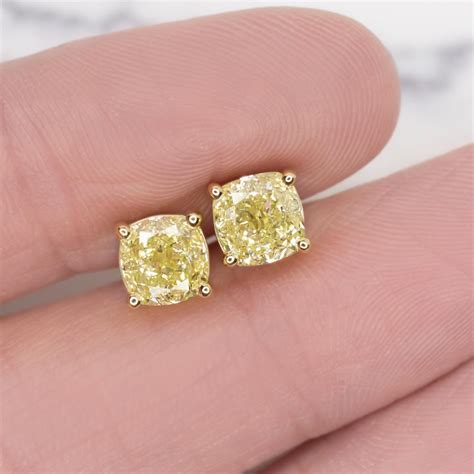 gia certified  carat fancy yellow cushion cut diamond studs set