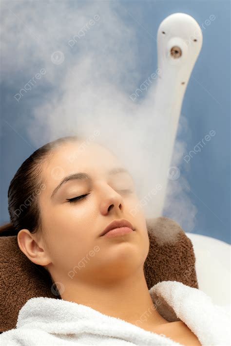 Woman Having Facial Steam Treatment In Spa Cleansing Natural Young