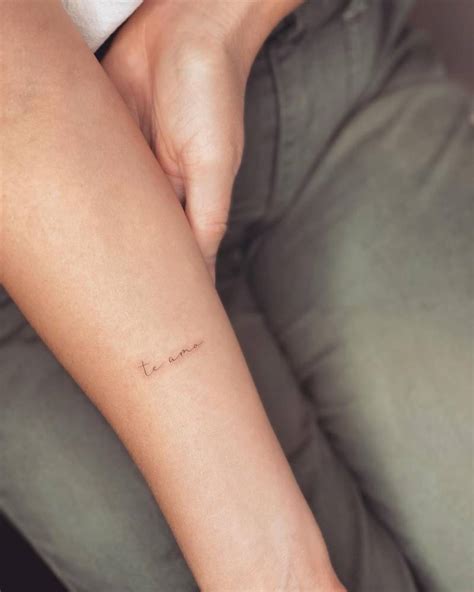 Tattoo that says "te amo" handwritten on the inner