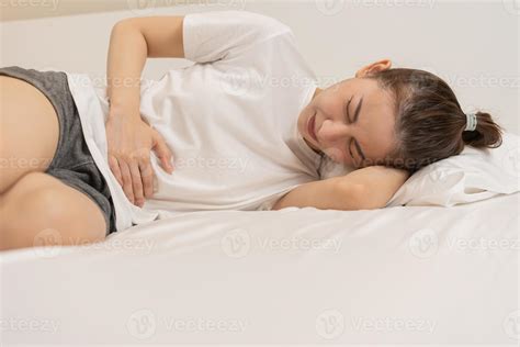 Flatulence ulcer, asian young woman, girl hands in belly, stomachache