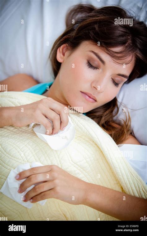 Woman suffering from rhinitis Stock Photo - Alamy