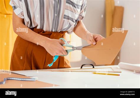 close  hand cutting paper stock photo alamy