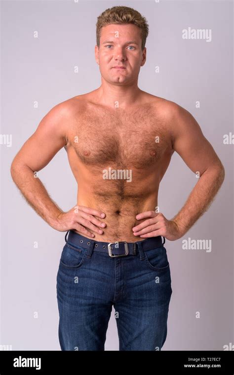 Portrait of young blonde man shirtless with chest hair Stock Photo - Alamy