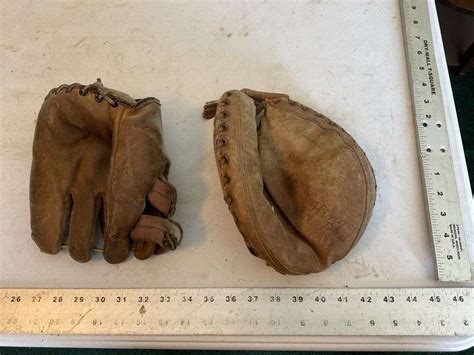 2- vintage baseball gloves - Legacy Auction Company