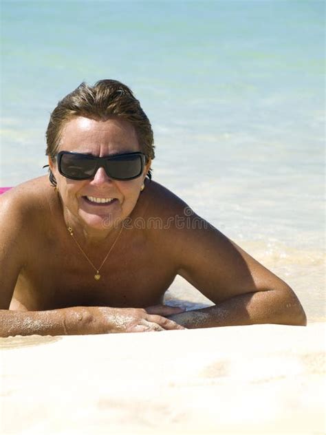 Topless Mature Sunbathing Stock Photos - Free & Royalty-Free Stock