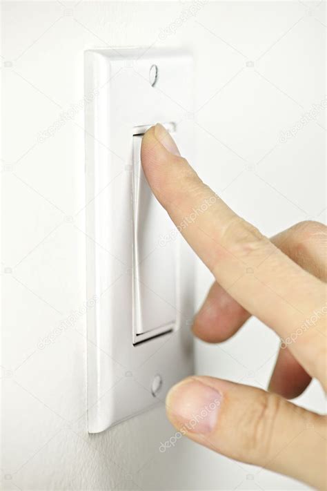 Turning off light switch — Stock Photo © elenathewise #4467378