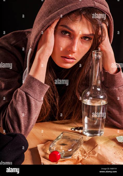 Drunk girl holding bottle of vodka Stock Photo - Alamy