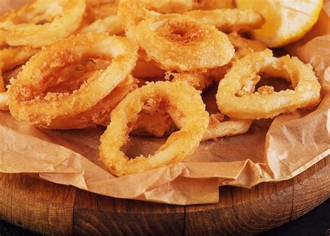Premium Photo | Oven baked breaded calamari rings served