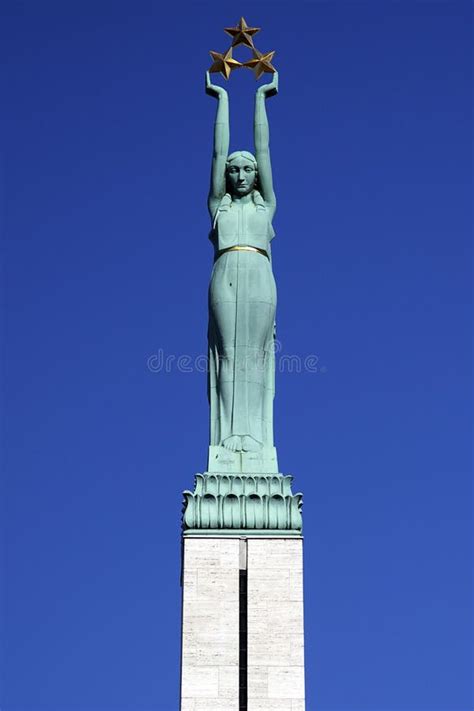 Latvia: Freedom Monument of Riga Stock Photo - Image of holding ...