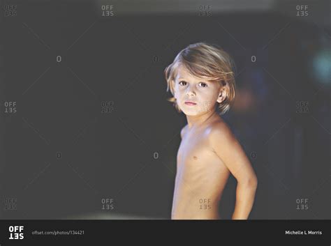 Portrait of a shirtless boy stock photo - OFFSET
