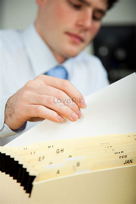 office worker filing documents picture  hd