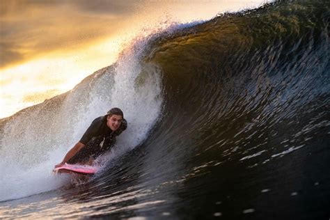 Topless Man Surfing · Free Stock Photo