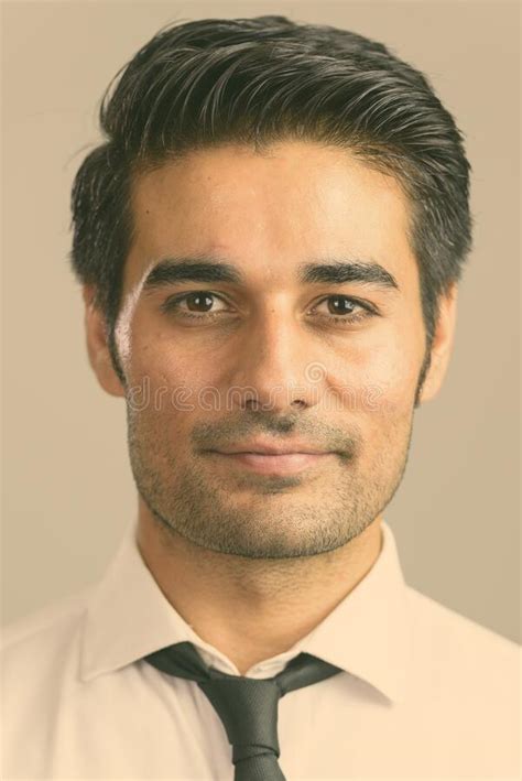 closeup profile view  happy handsome persian man   camera