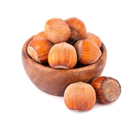 Premium Photo | Hazelnut in wooden bowl, isolated on white. nut macro ...