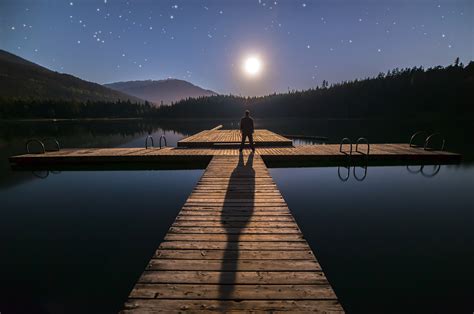 Standing on the docks looking at the moon and stars in British Columbia