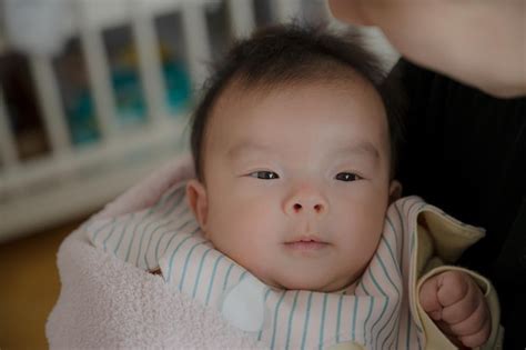 Premium Photo | Baby being held