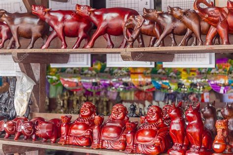 Wooden crafted figurines in a souvenir shop, cambodia, siem reap Stock ...