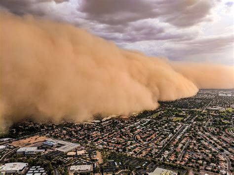 WALL OF DUST: Monsoon activity kicks dust and rain into Phoenix Area in