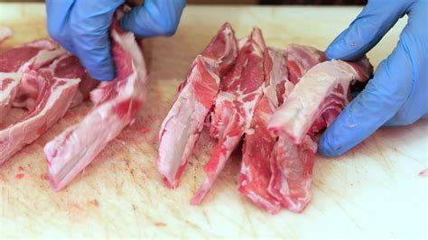 cutting raw meat  chopping board  local store  stock video