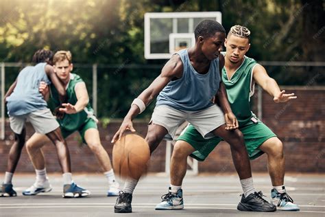 premium photo sports team  men playing basketball   competition
