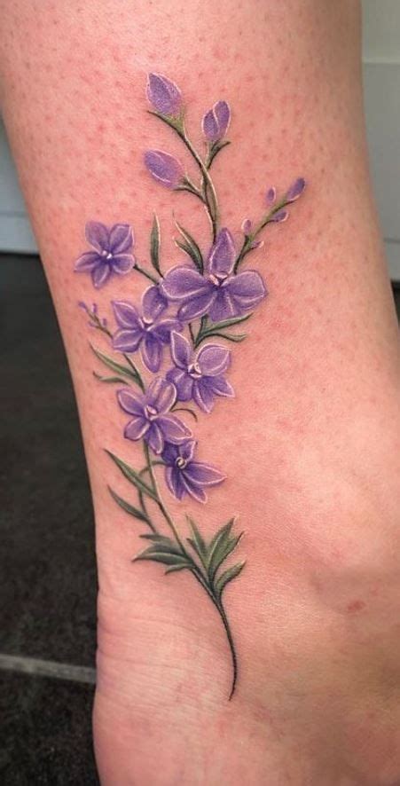 100 Larkspur Tattoos | Larkspur tattoo, Purple flower tattoos, Purple ...