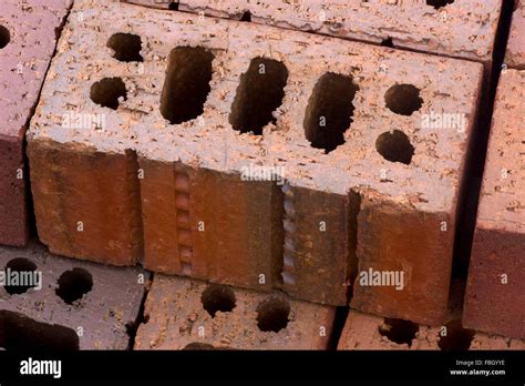 An individual brick, on a palette of brick construction materials Stock ...