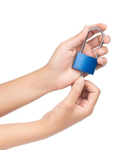 Premium Photo | Hand holding blue lock isolated on white background